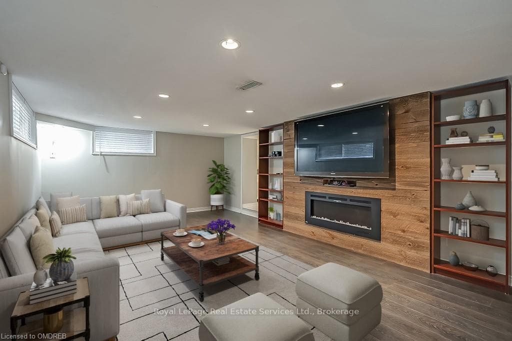 Living room with hardwood / wood-style flooring