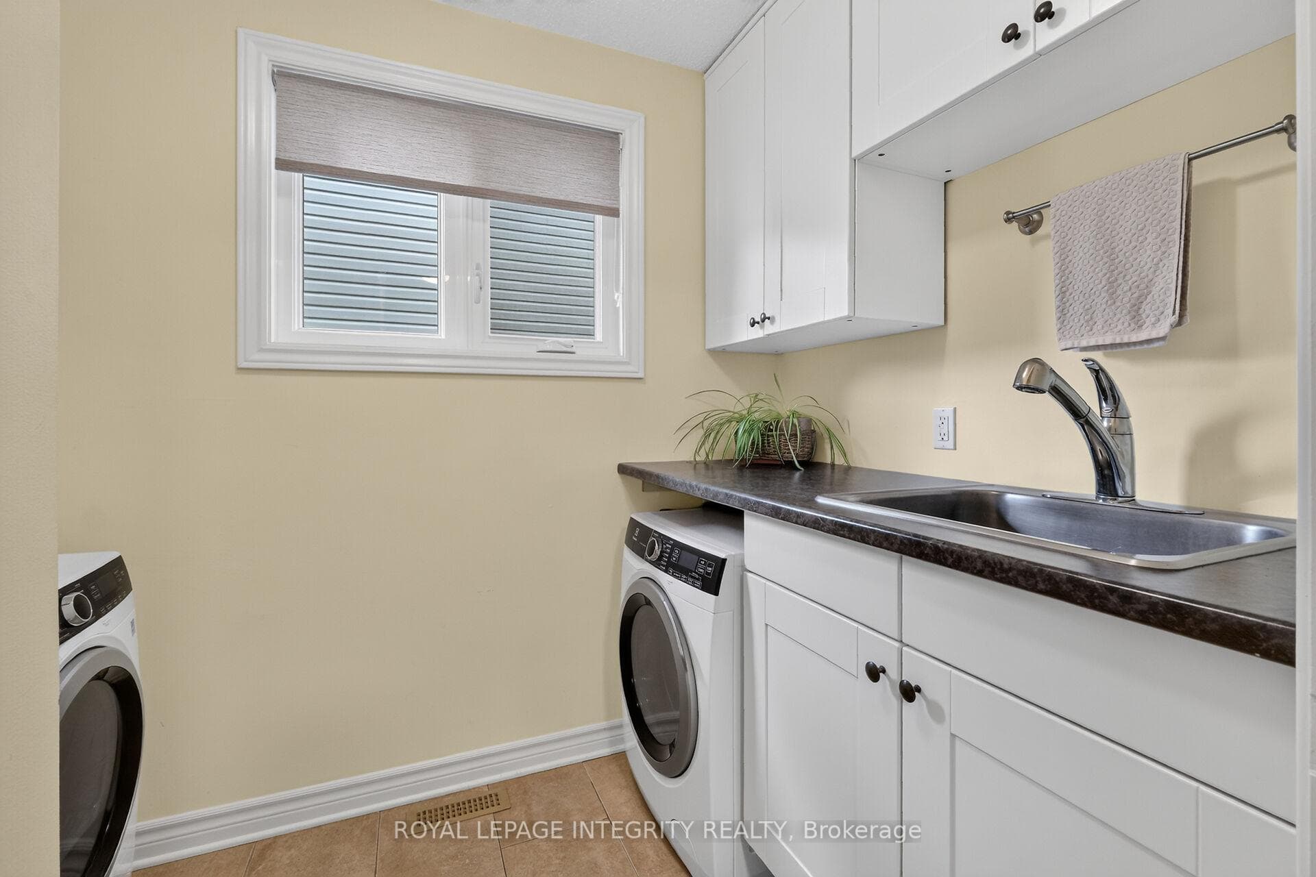 Updated laundry rm with sink and countertop