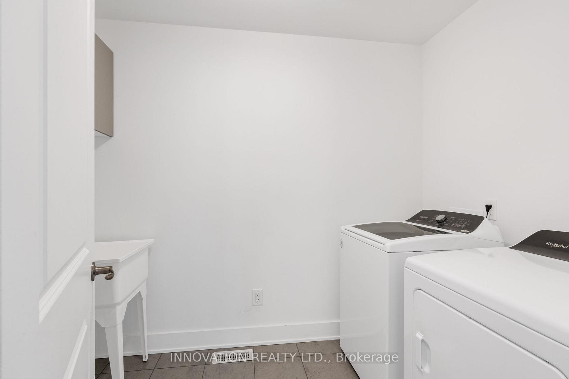 Second level laundry room with laundry sink.