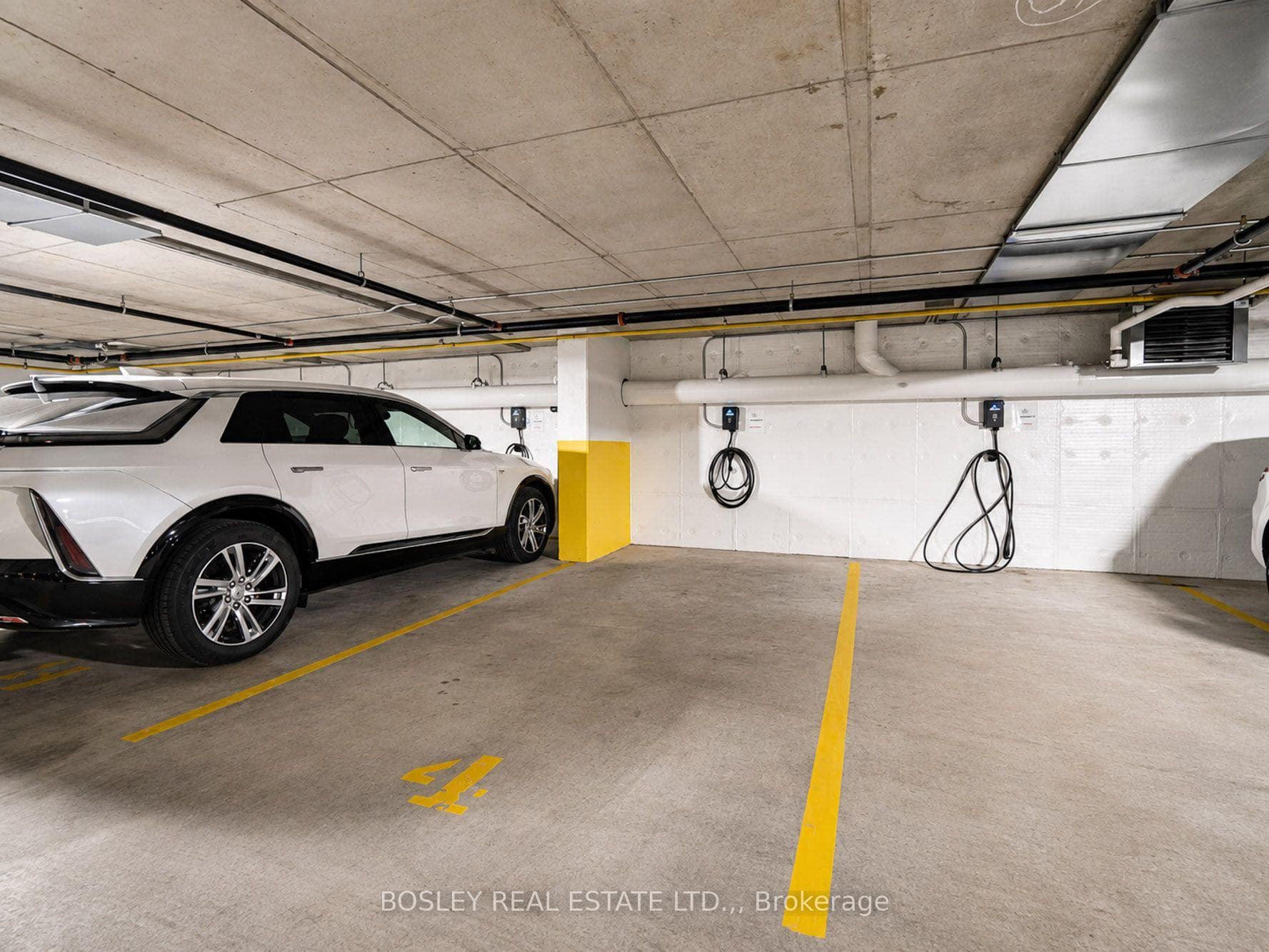 Suite includes 2 parking spots - 1 with EV Charger