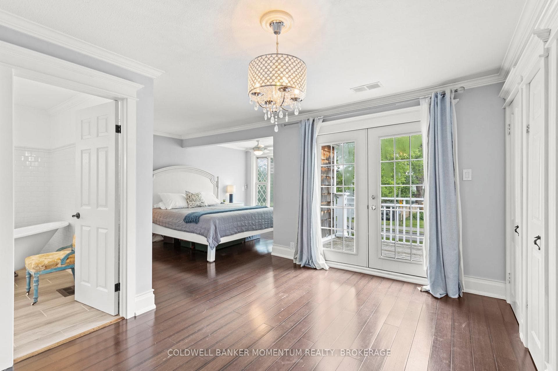 primary suite with walk-out to balcony