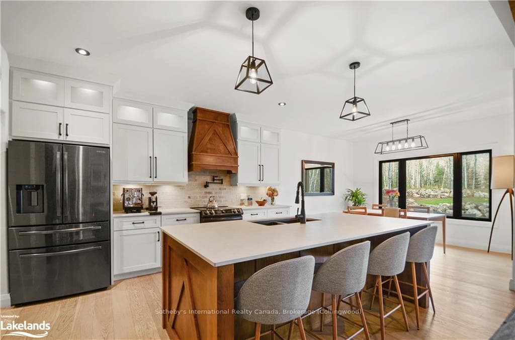 Kitchen featuring stainless steel appliances, whit
