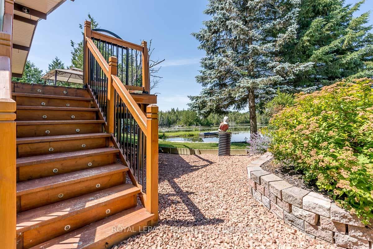 Enter Lower Level Under Deck or Side Entrance