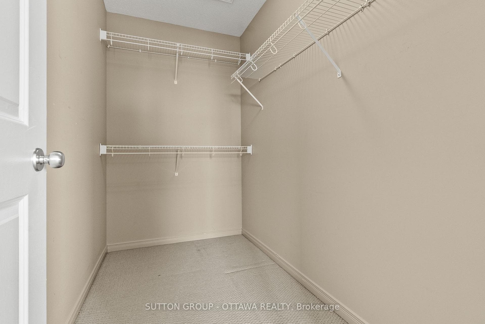 Primary bedroom walk-in closet.