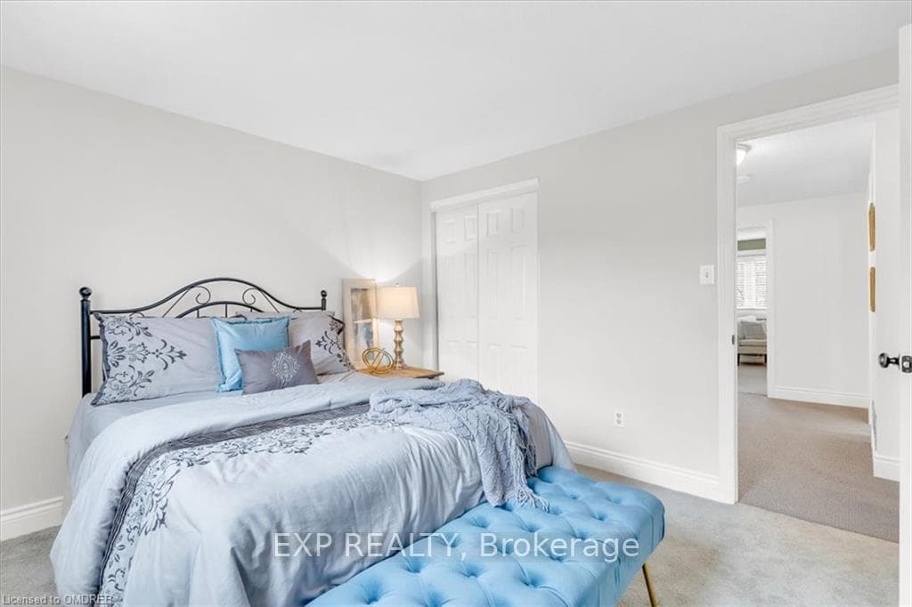 Bedroom with closet and large windows