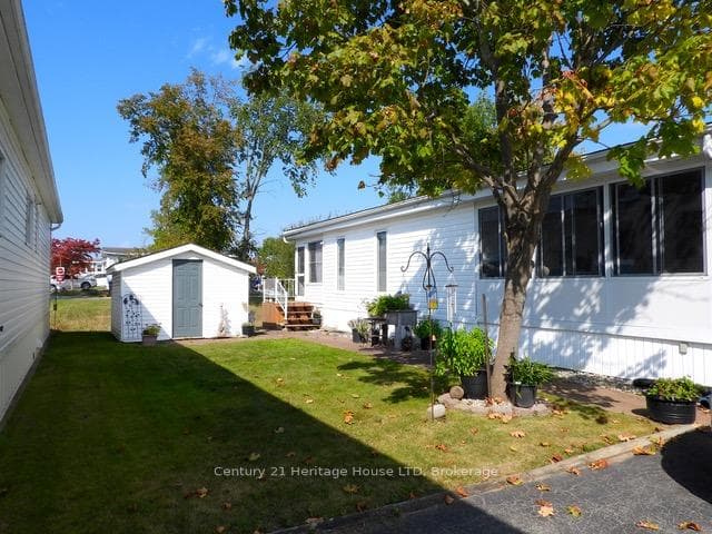 side yard, shed and rear sunroom