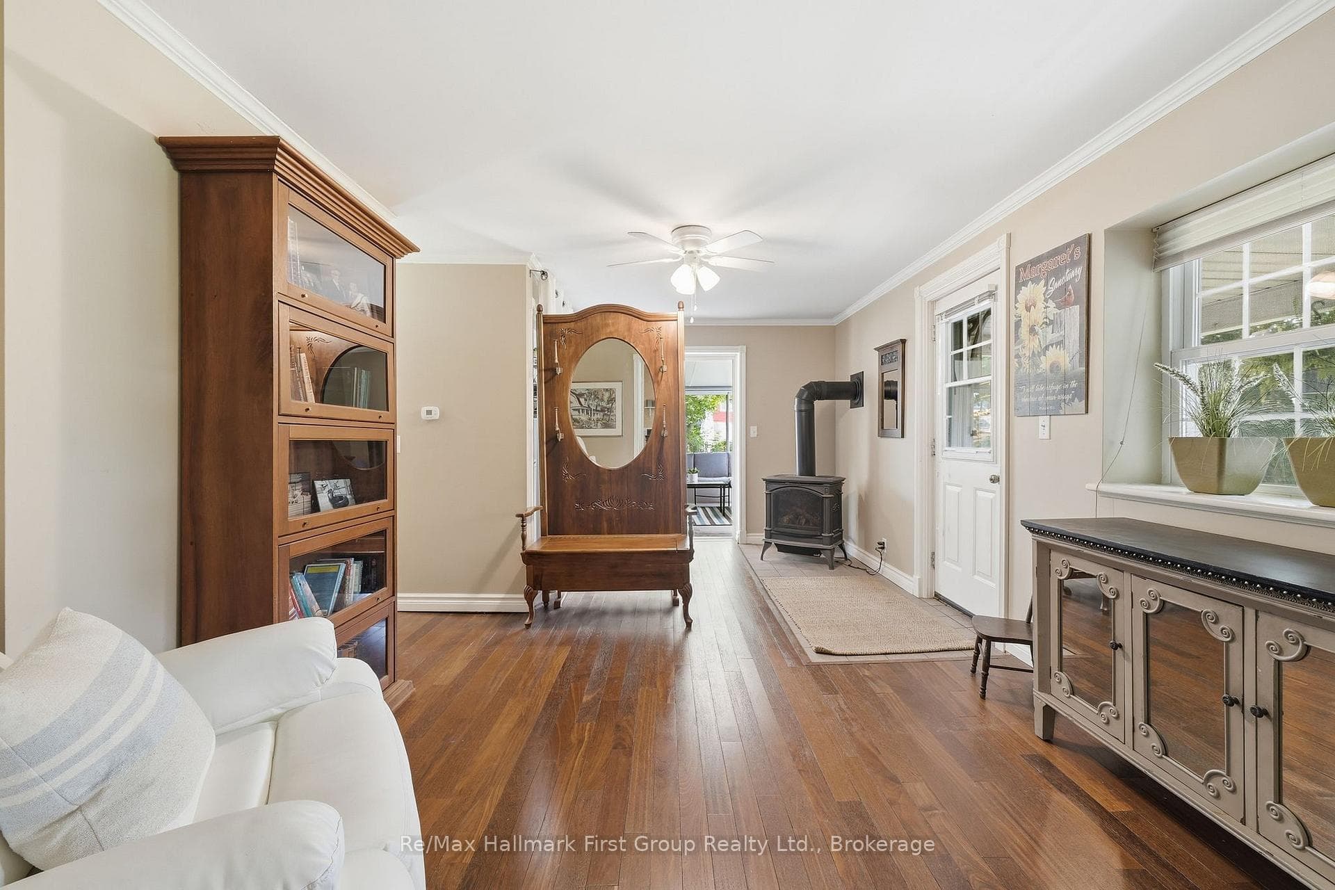 Den with gas fireplace and side porch door