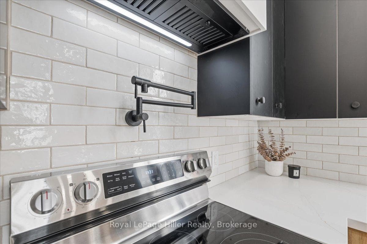 Tiled Backsplash and Pot filler above Stove