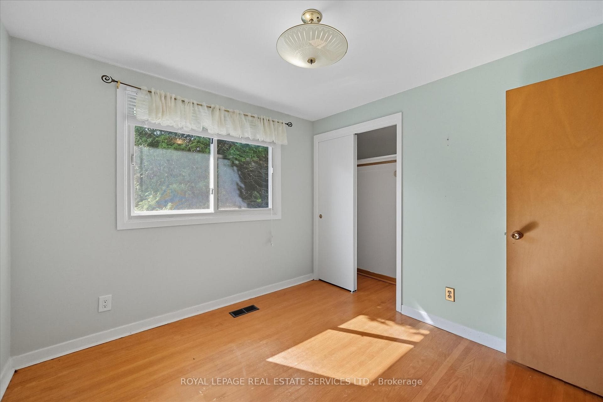 Second Bedroom with Hardwood Flooring