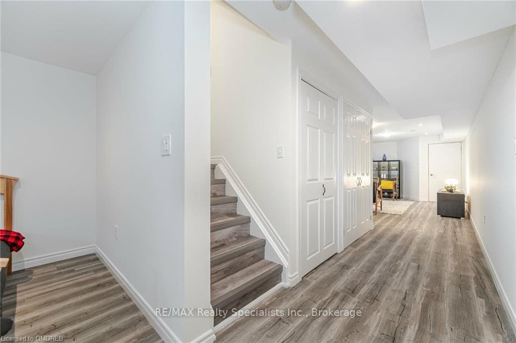 Stairs with hardwood / wood-style flooring