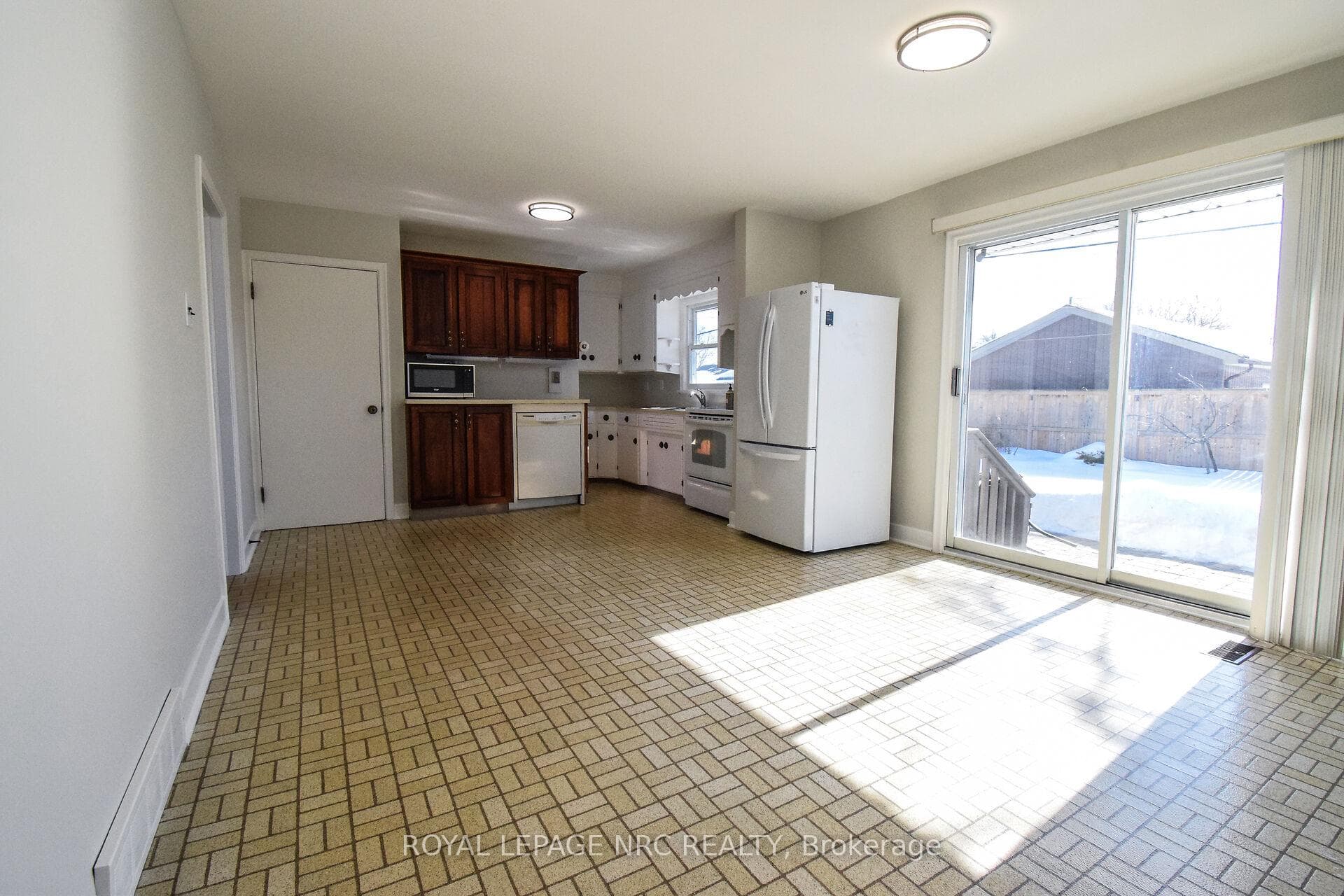 Lots of potential for this large eat in kitchen.