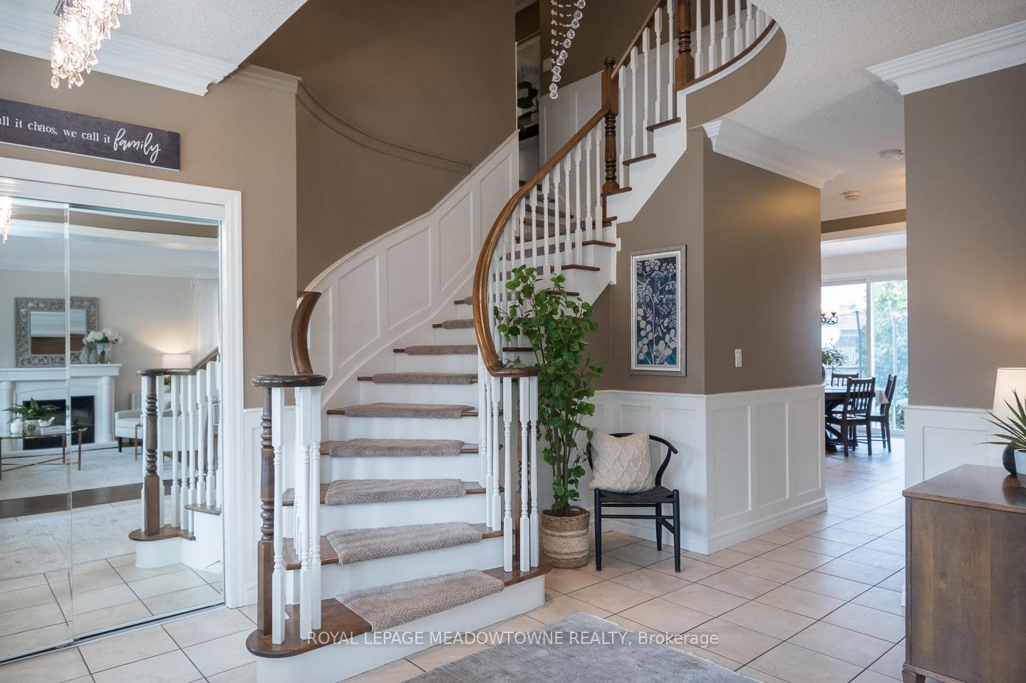 Soaring 9 ft ceilings curved piano style staircase