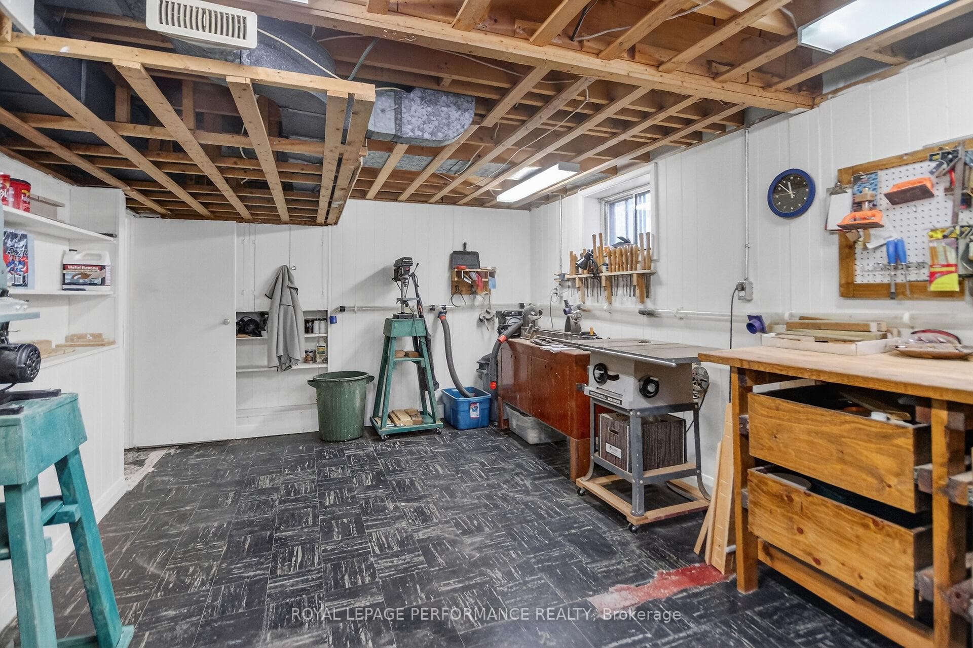Workshop with lots of storage room/shelves.