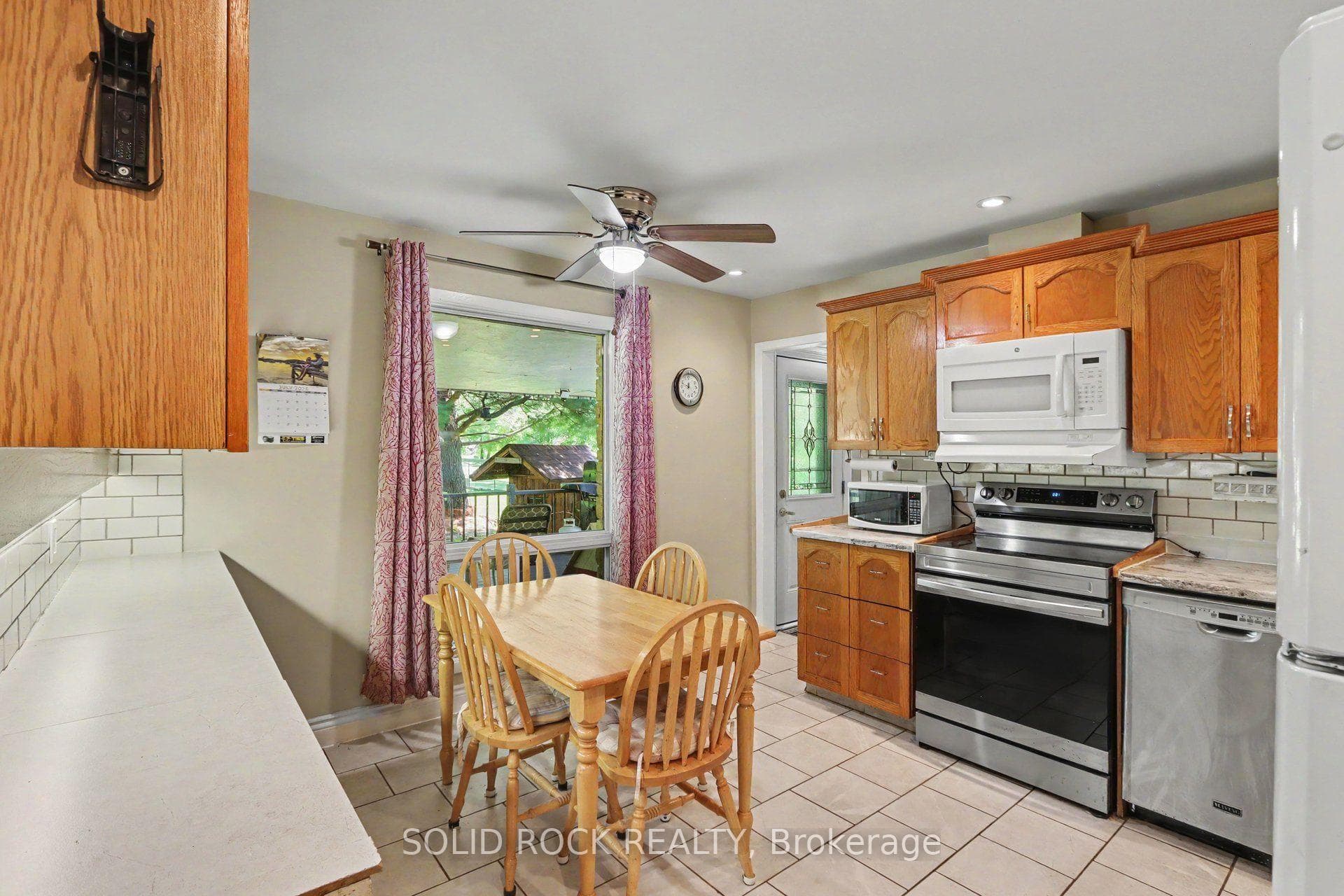 Kitchen with rear yard access to covered porch