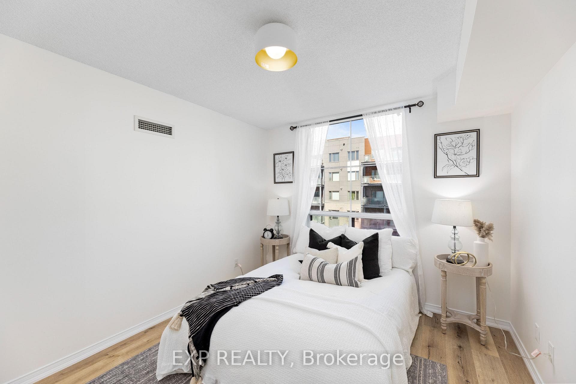 Primary bedroom with large window