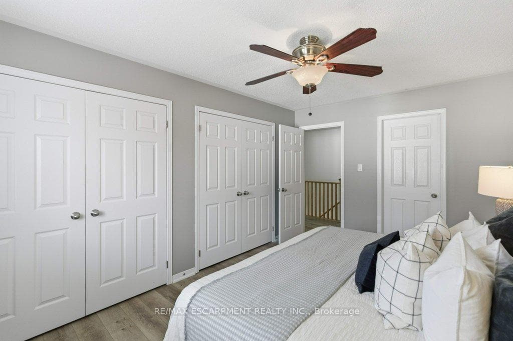 His and hers closets in primary bedroom