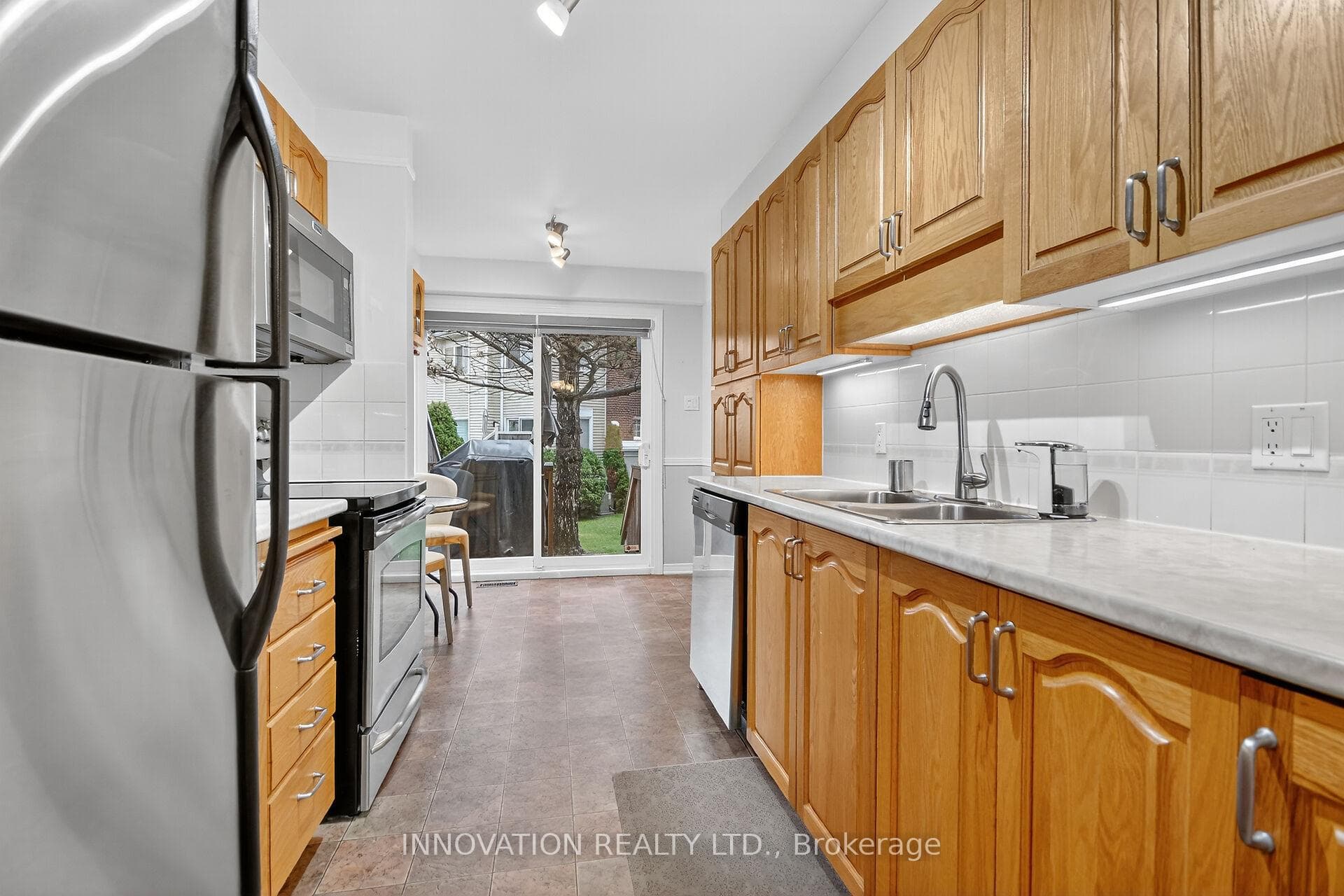 Kitchen has a great flow and easy access- backyard