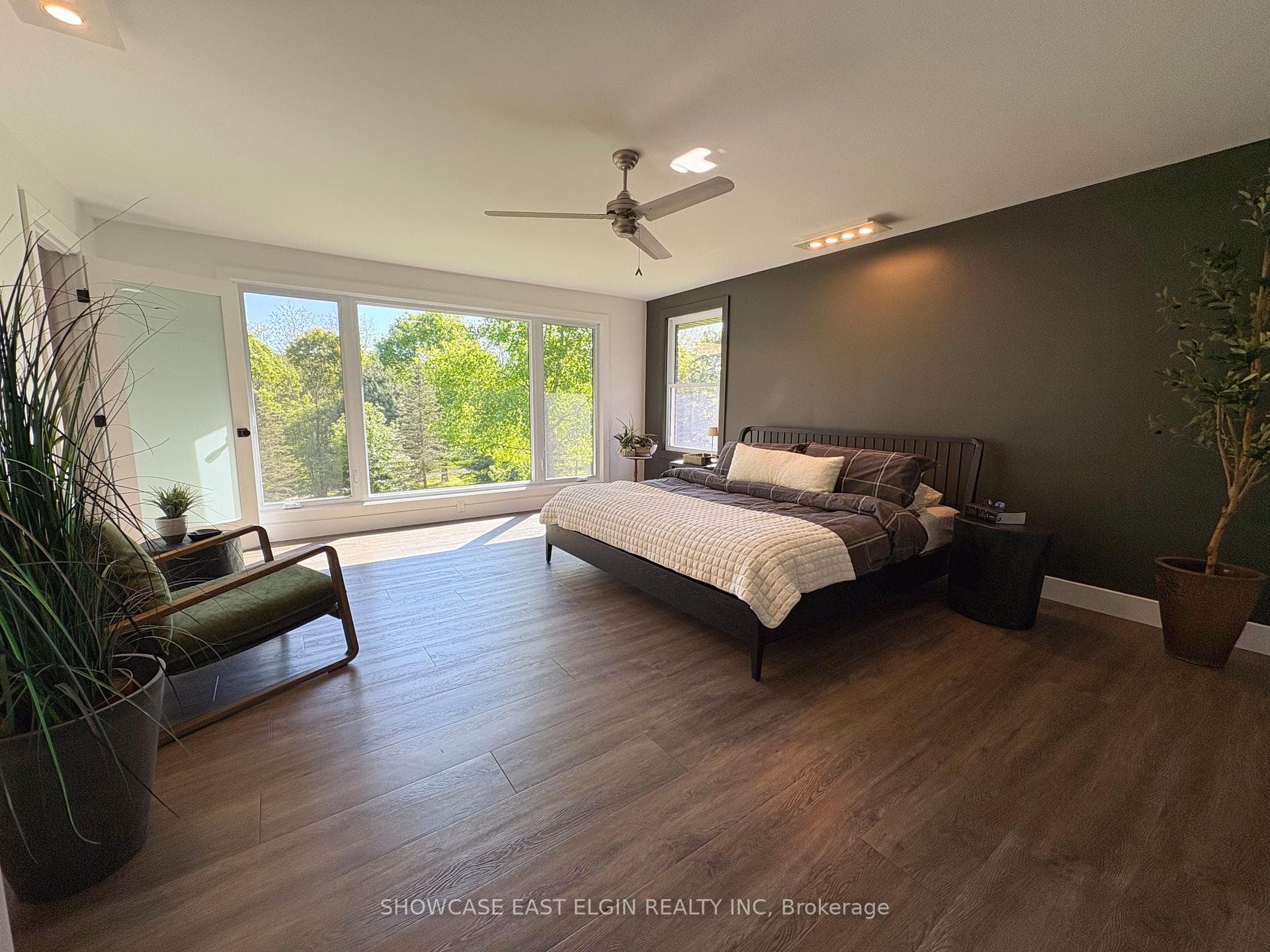 primary bedroom overlooking the yard and park