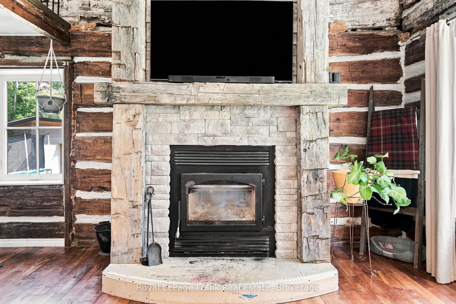 Living room with wood burning fireplace