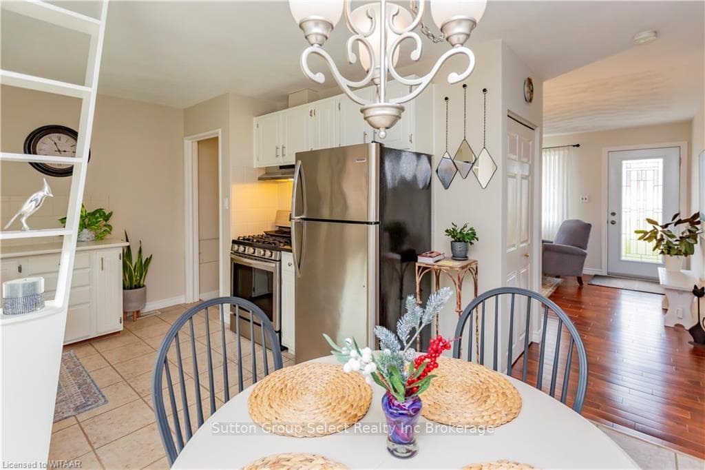 Dining room featuring a chandelier and light hardw