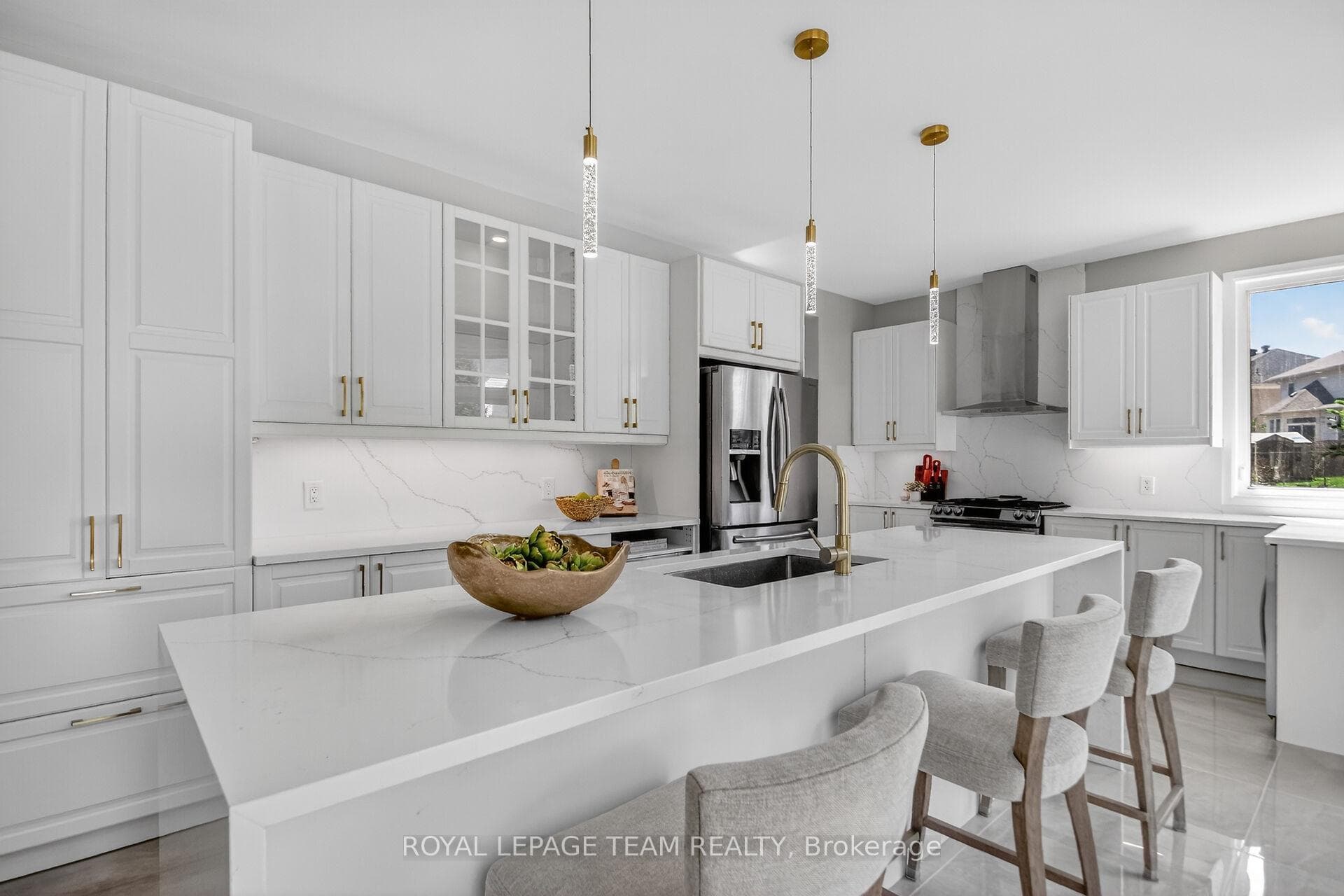 Kitchen with quartz counters, quartz waterfall