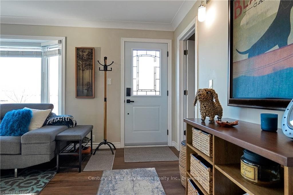 Foyer entrance featuring dark hardwood / wood-styl