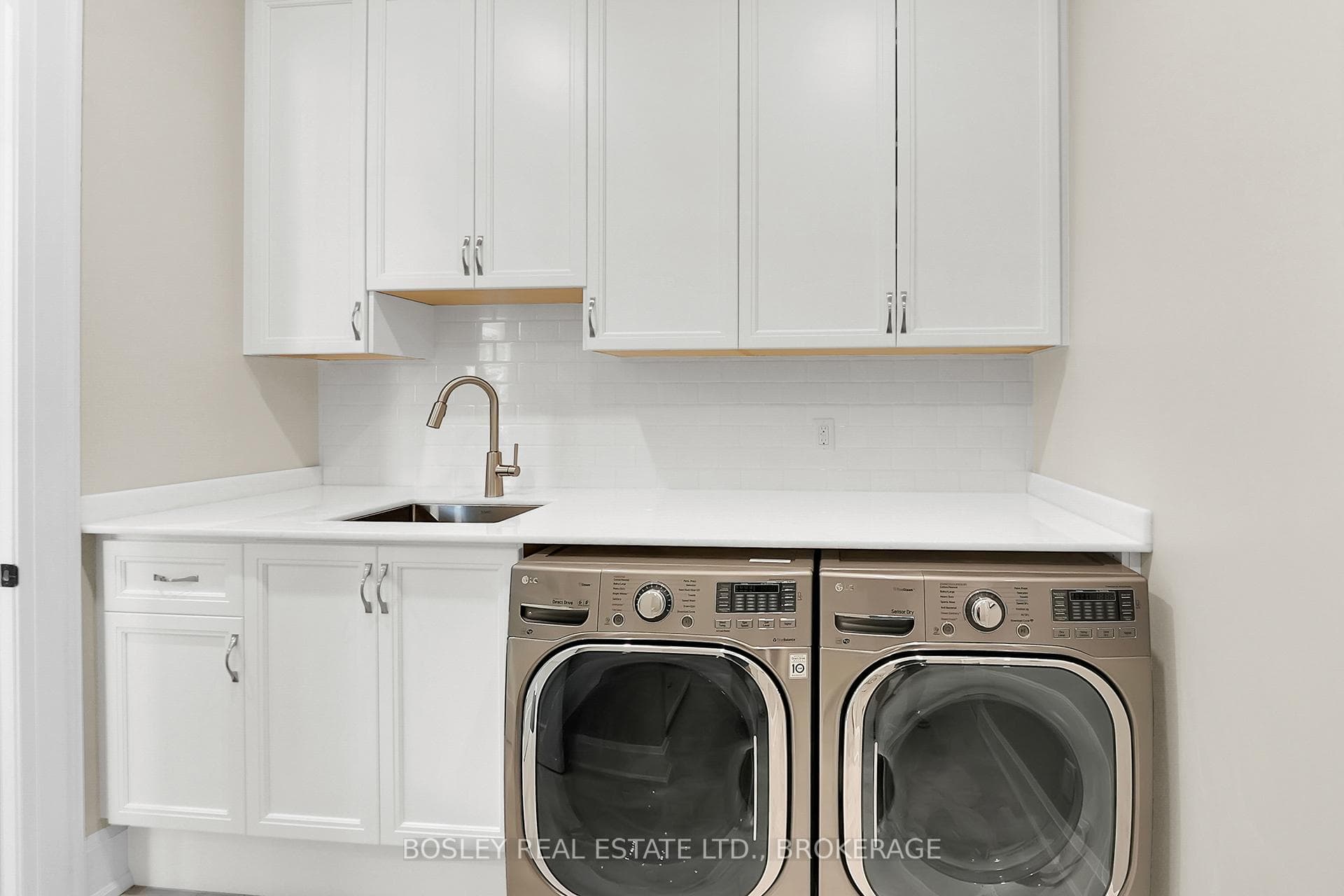 laundry / mud room with folding counter, storage