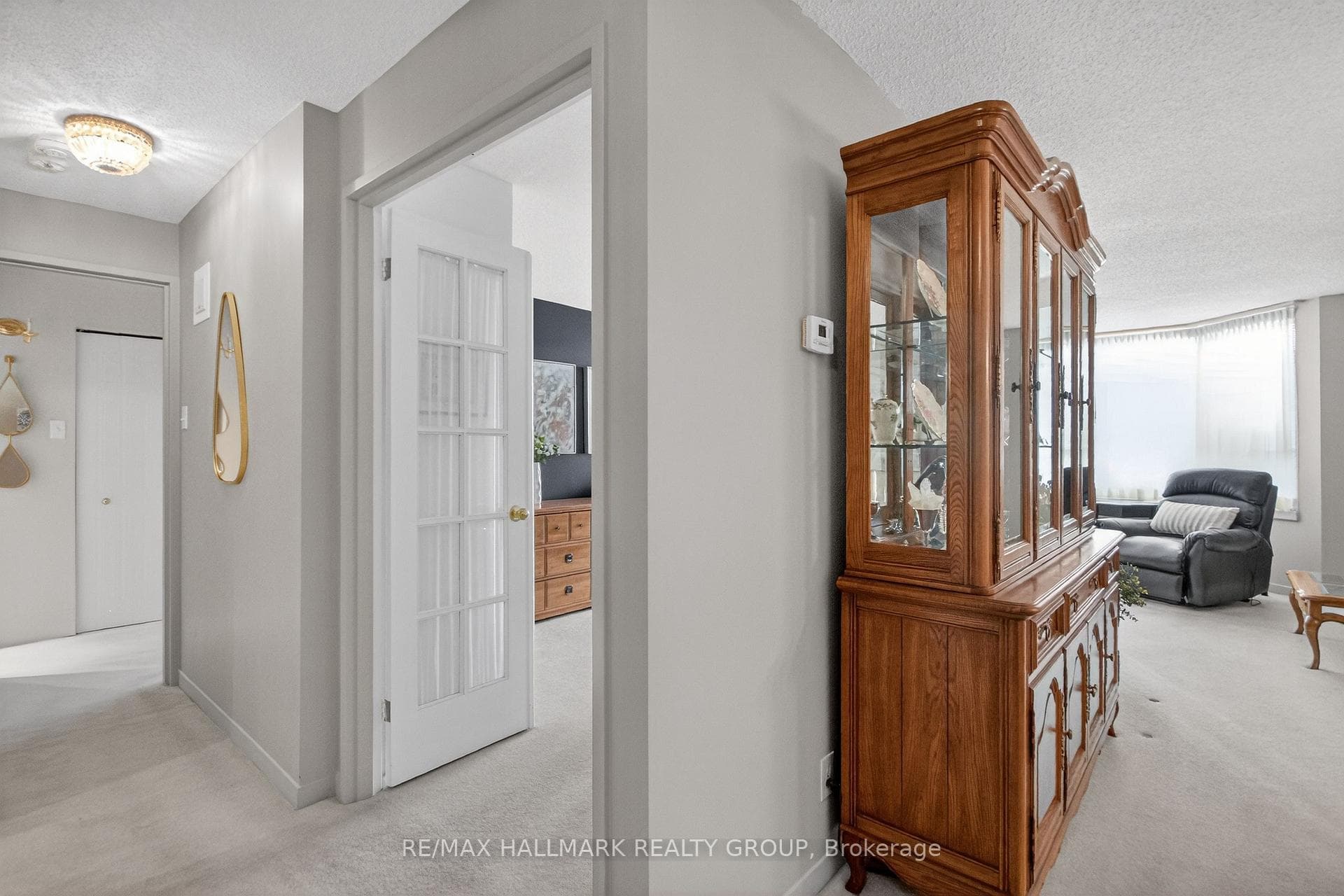 Hallway with powder room, leads to bedrooms