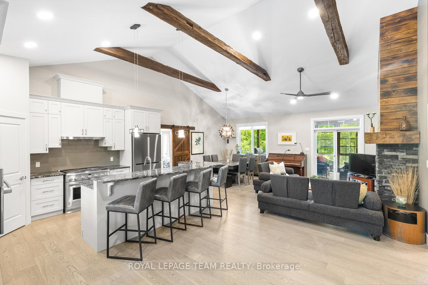 Open living space with reclaimed wood beams