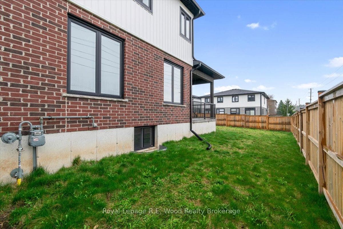 side view with fenced yard