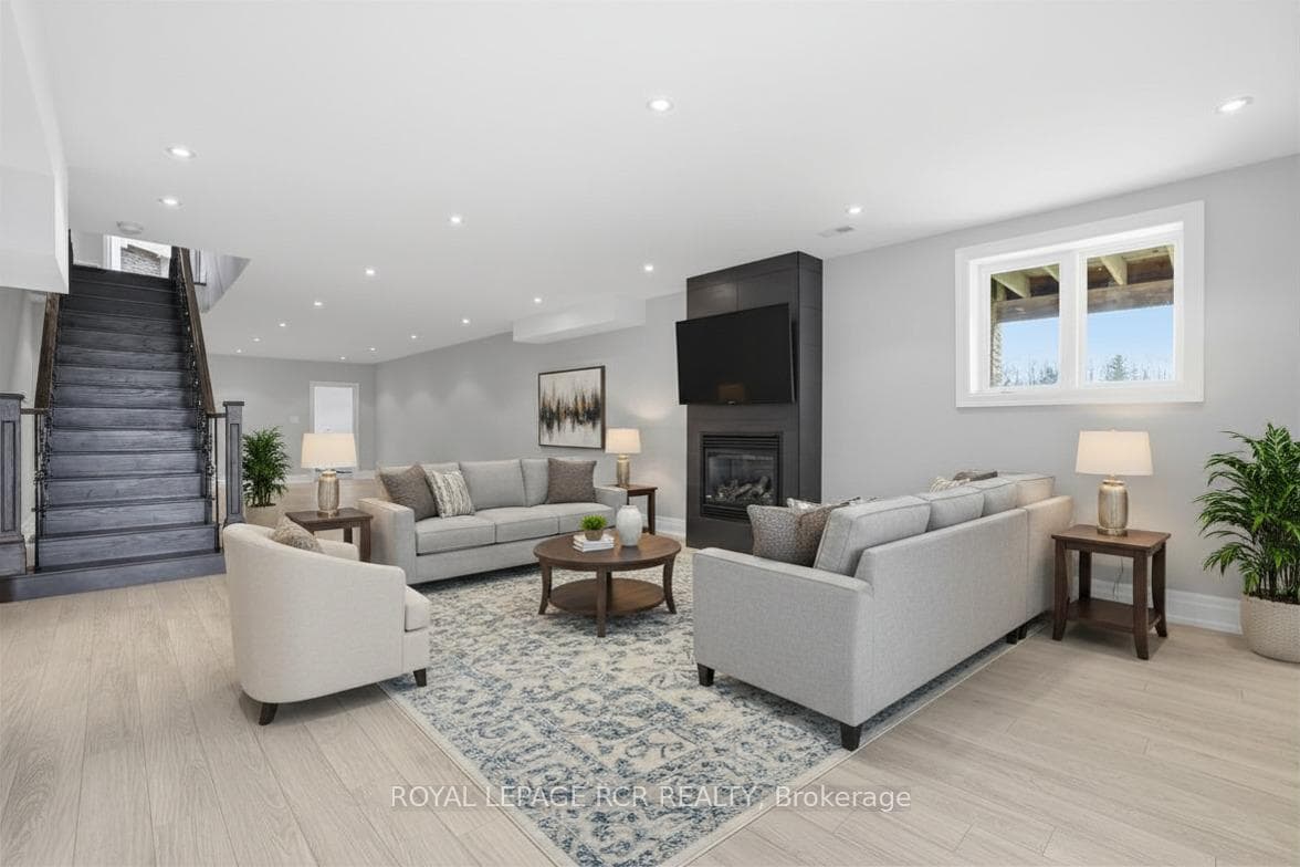 Virtually Staged Image Lower Level Fam Rm with F/P