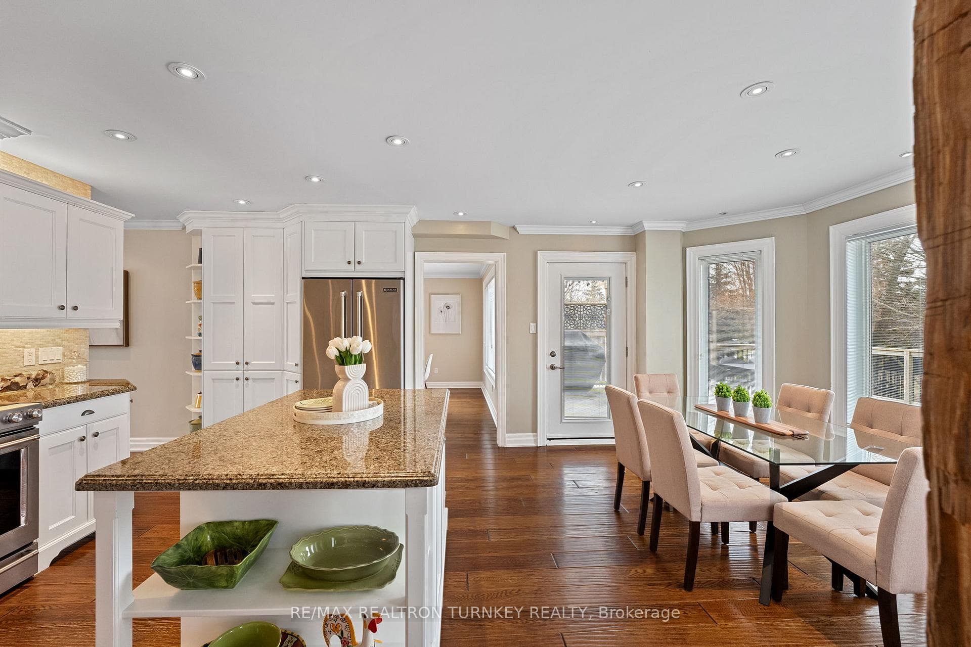 Breakfast bar area with walk out door to back deck