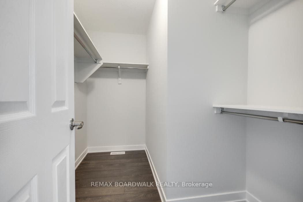 Primary bedroom walk in closet