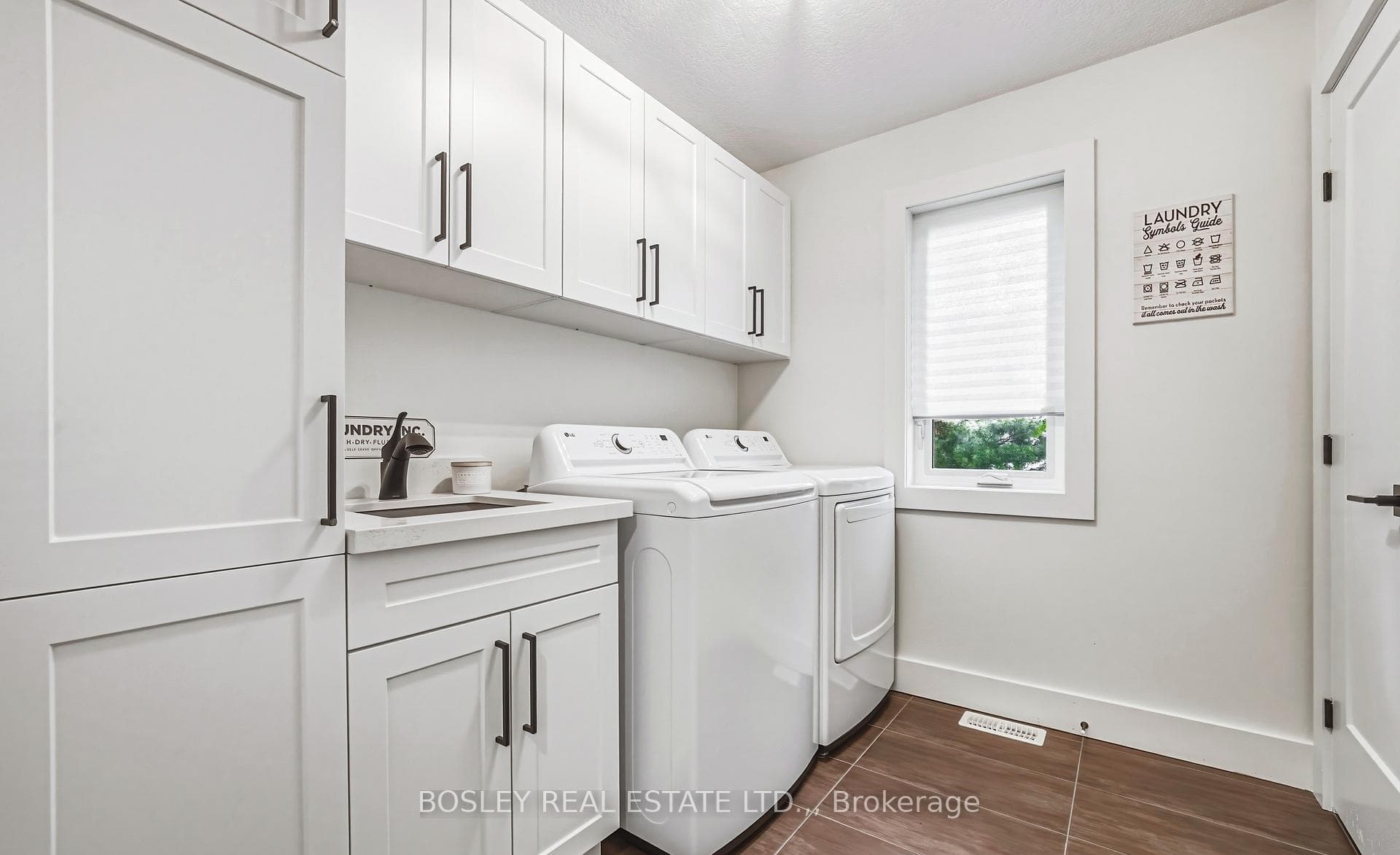 Upper Laundry- with sink and full cabinetry