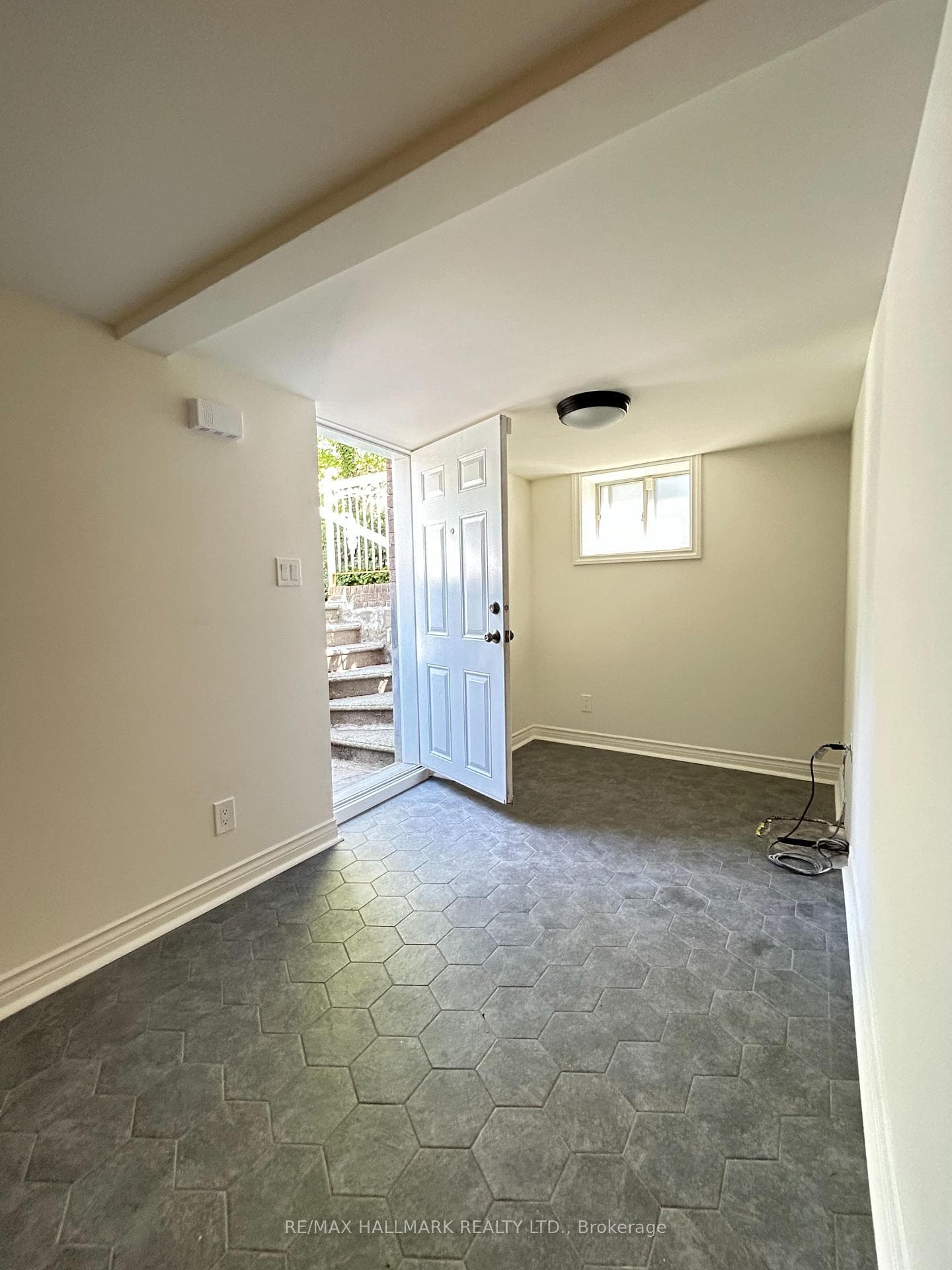 Spacious den/office w/2 large windows & walkout