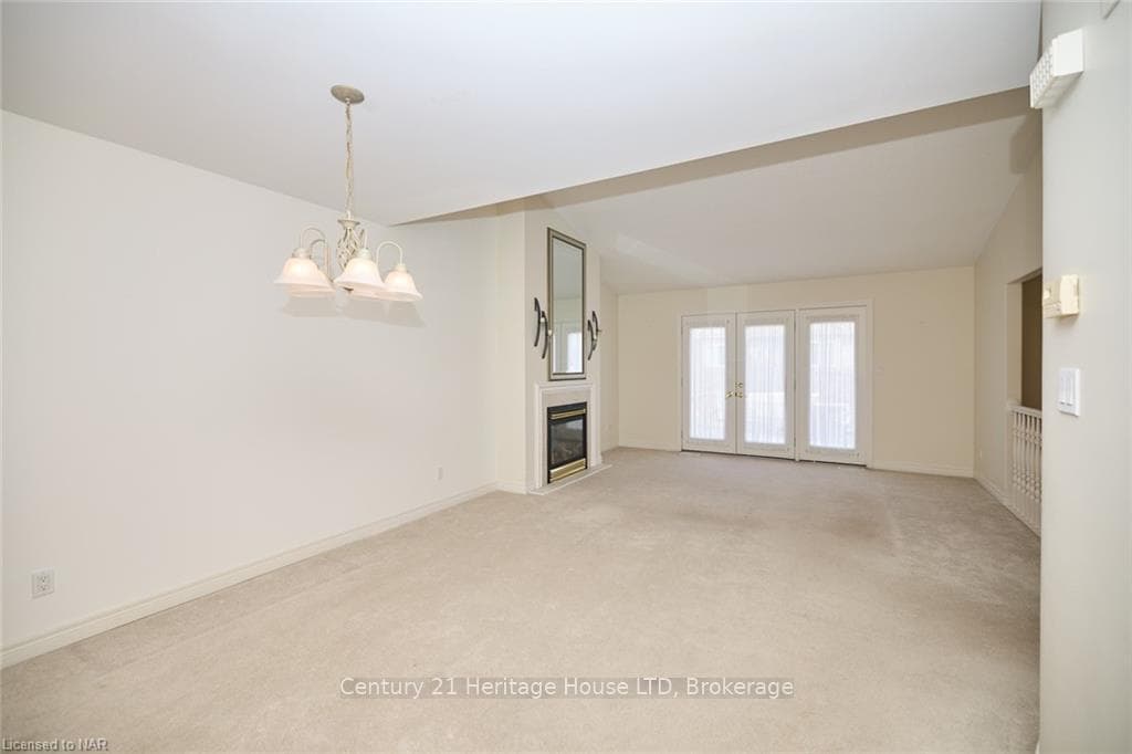 Living Room w/ Broadloom & Fire Place