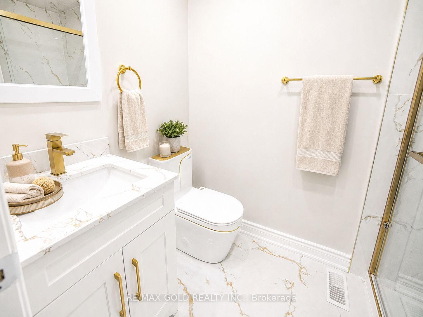 Bathroom with marble-look shower tile, glass encl.