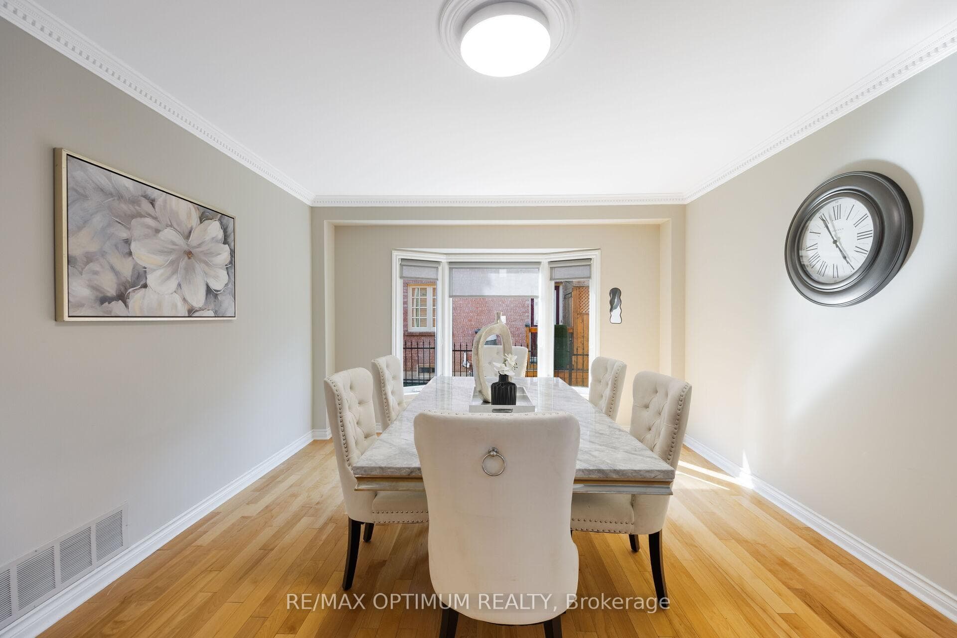 Elegant formal dining with bay window