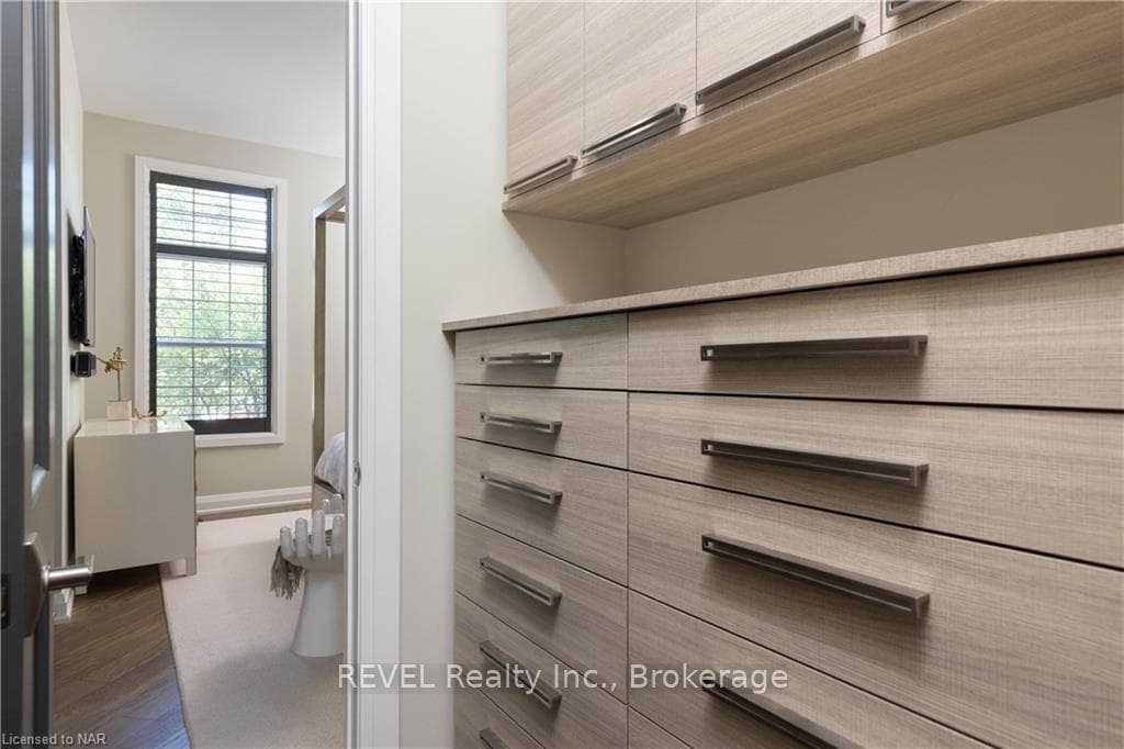 Expansive walk in closet with well appointed built