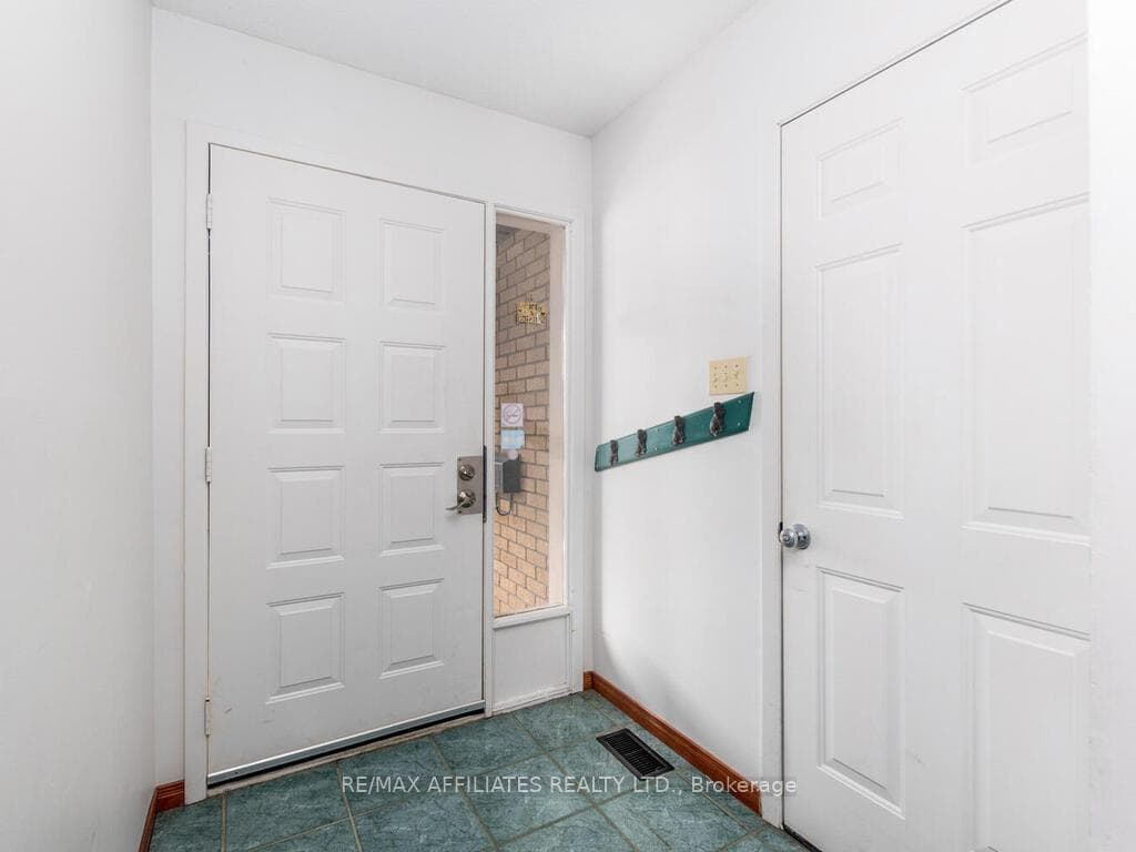 Foyer with door to attached garage