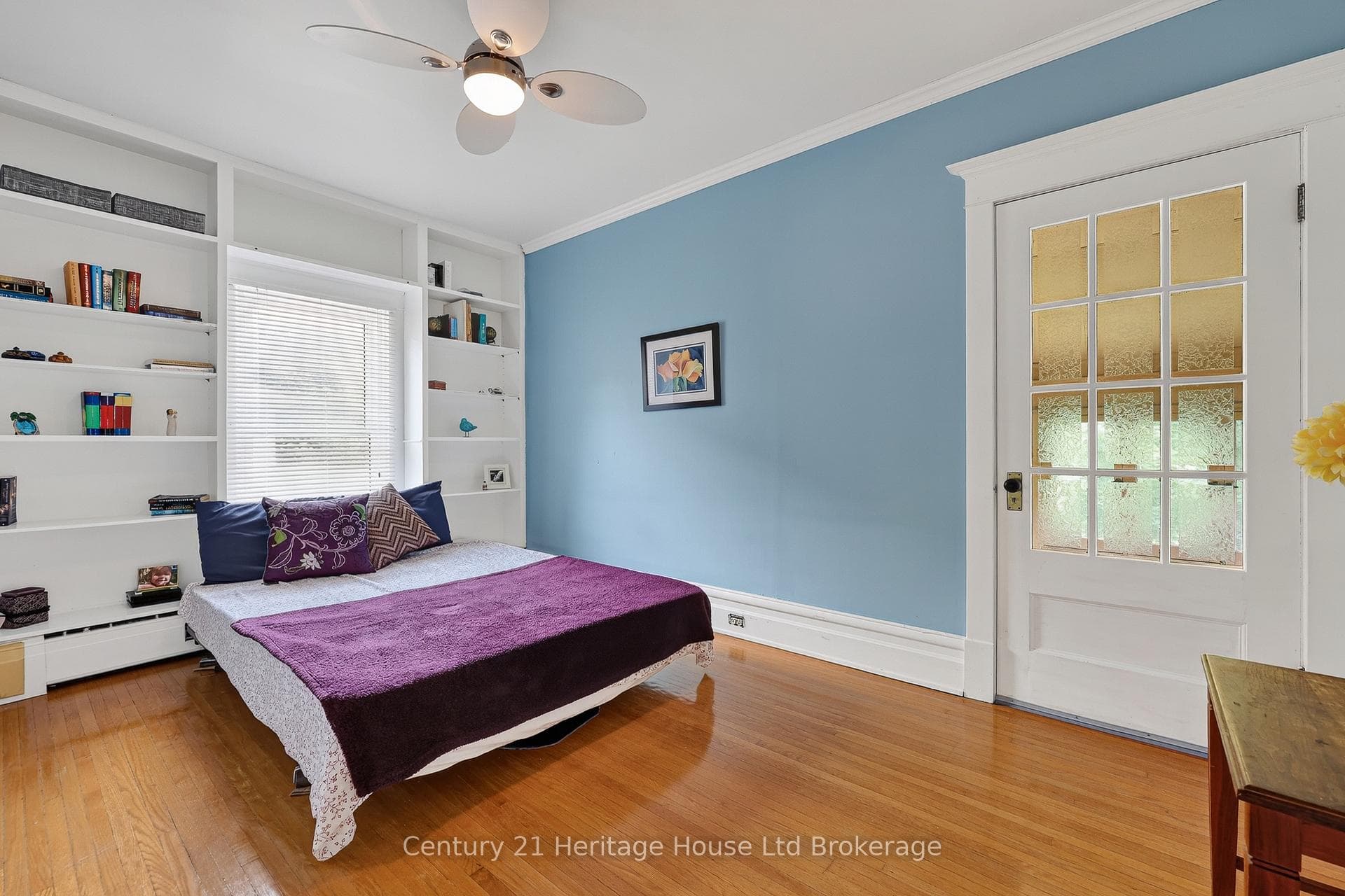2nd floor bedroom with access to screened in porch