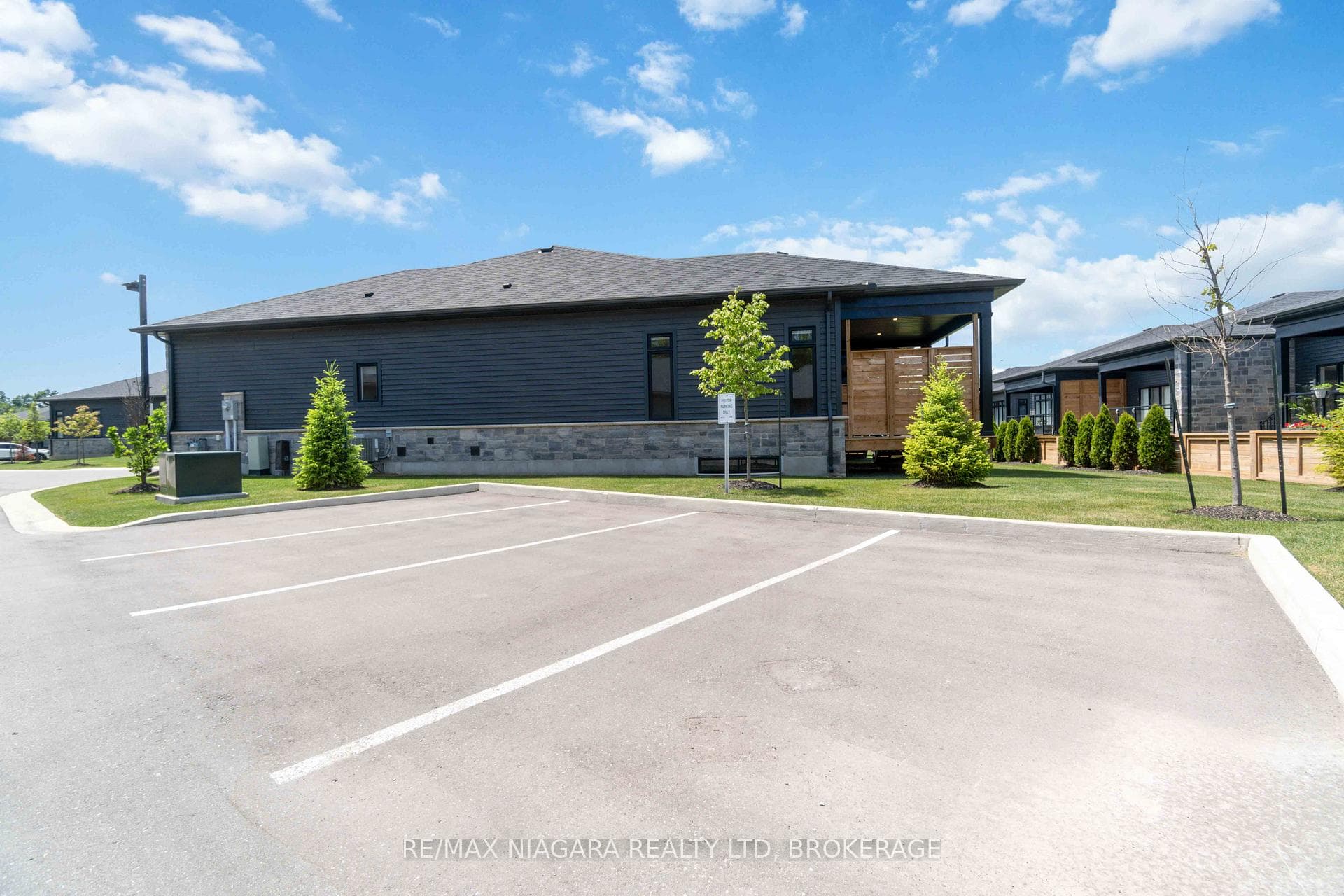 located beside visitor parking