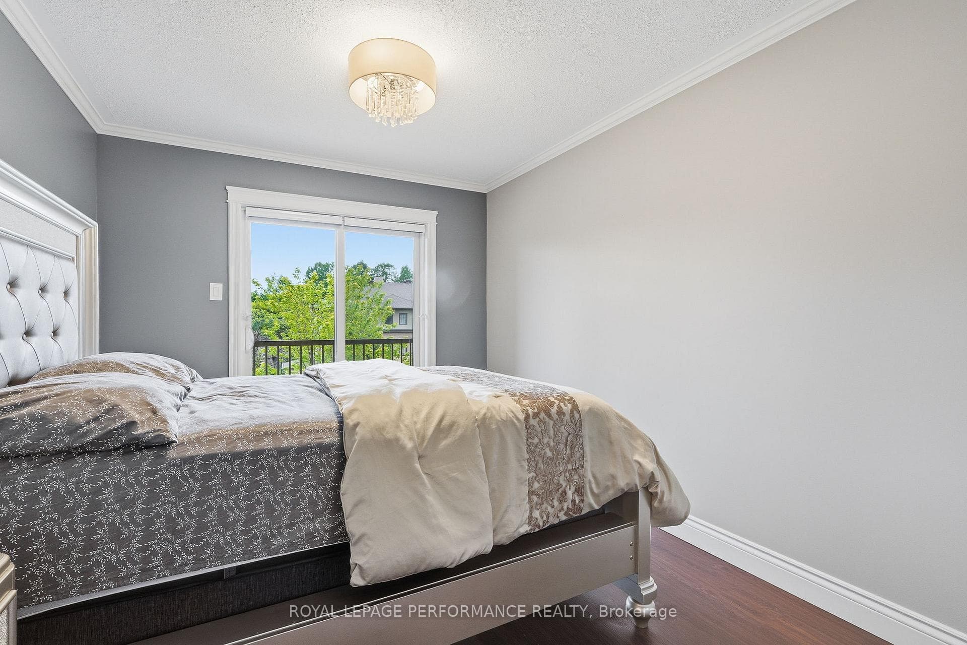 2nd floor bedroom with patio door to deck
