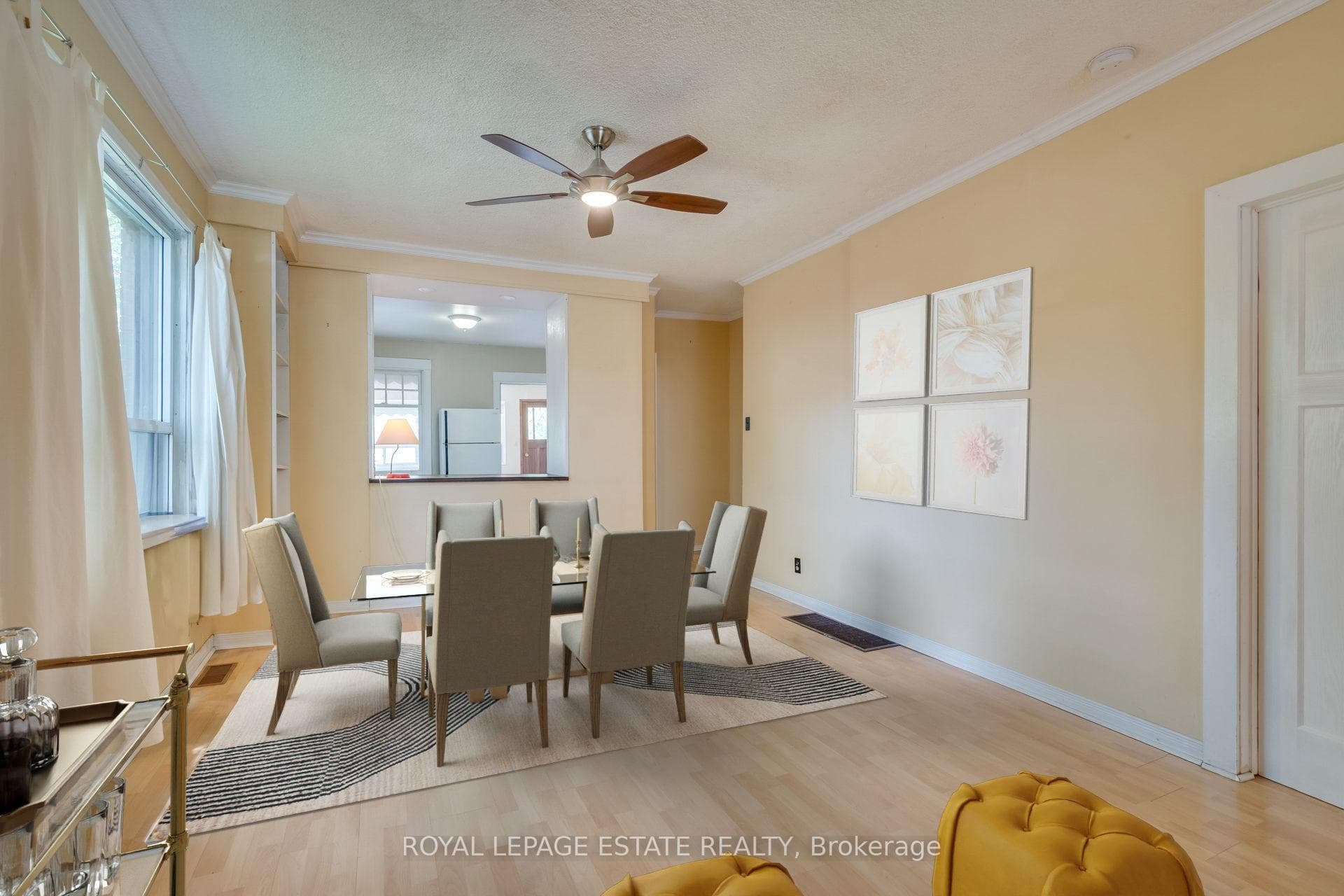 sunny main floor dining room with pass through