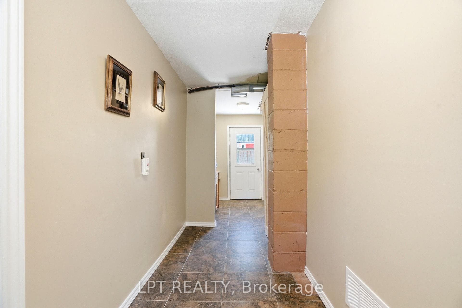 Back hall leading to the garage, and laundry room.
