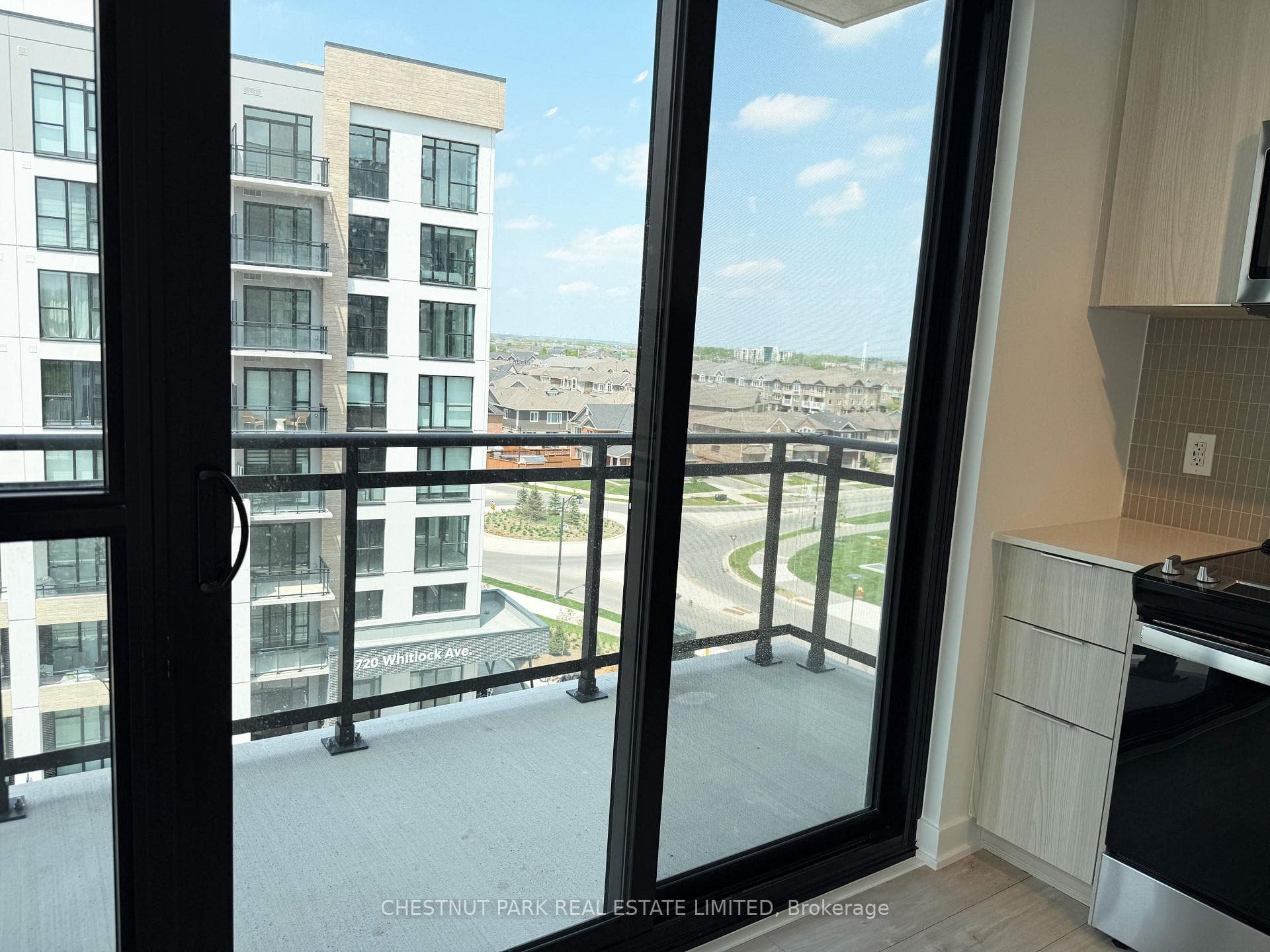 Walk-out to balcony from open concept kitchen