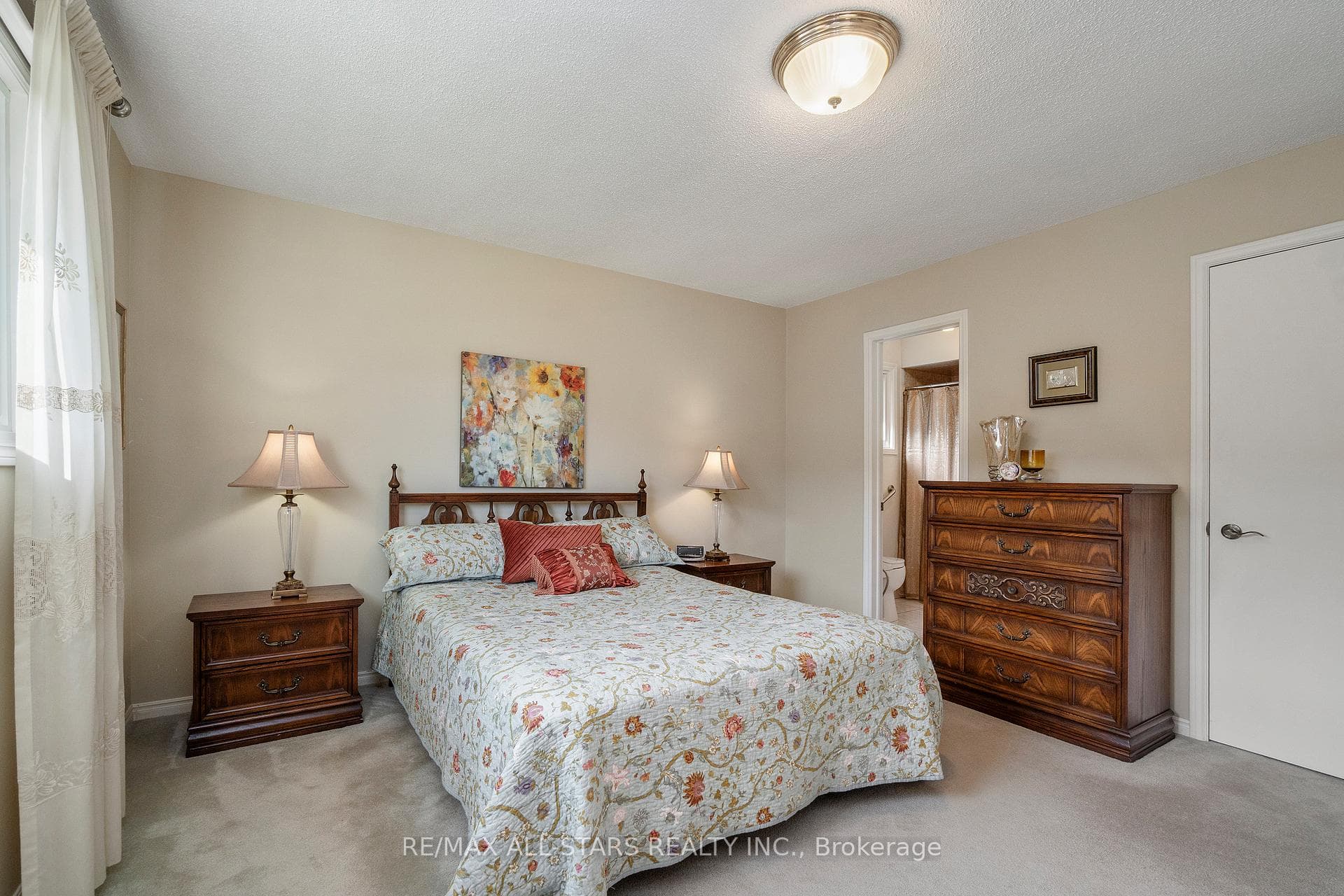 Primary bedroom w walk in closet & bath access