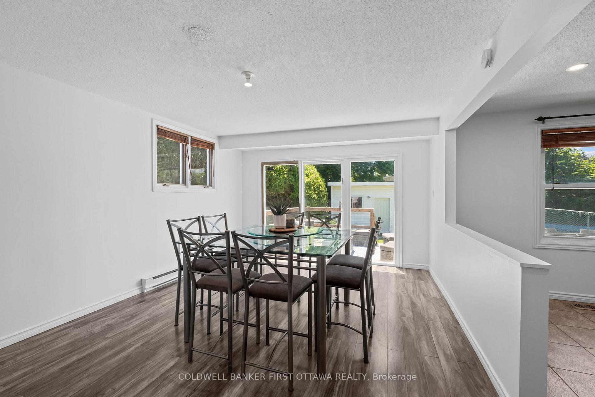 Dining room w walkout to the back deck + Pool!