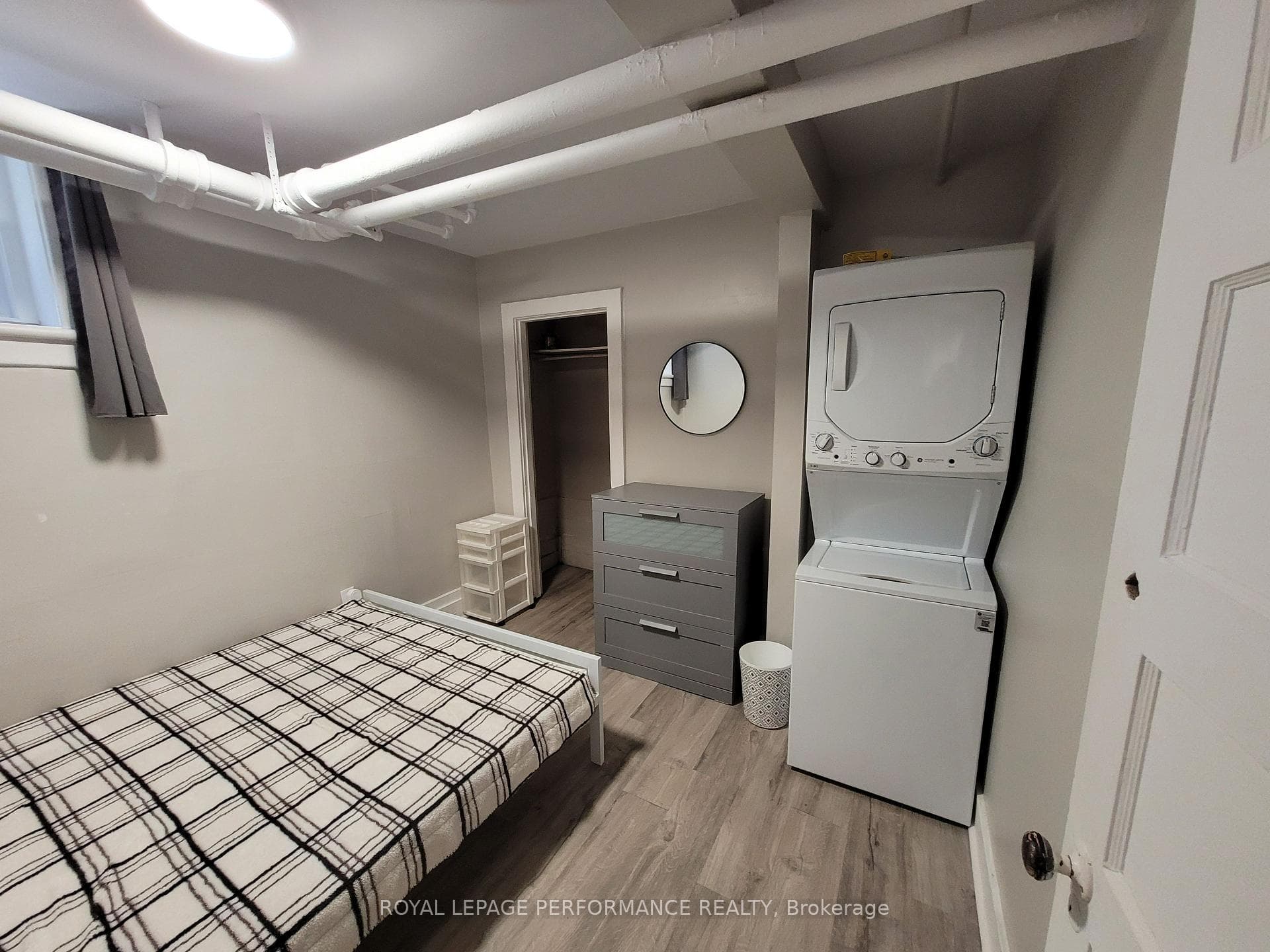 Primary bedroom with laundry facilities