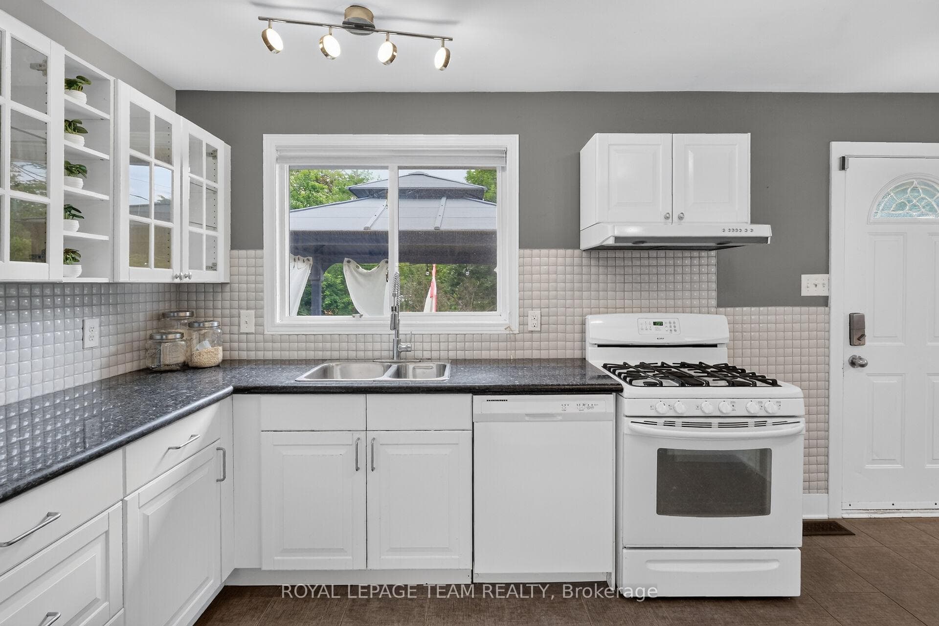 Updated Kitchen w/crisp white cabinetry.